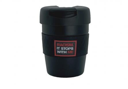 Black reusable coffee cup with "Racism It Stops With Me" logo