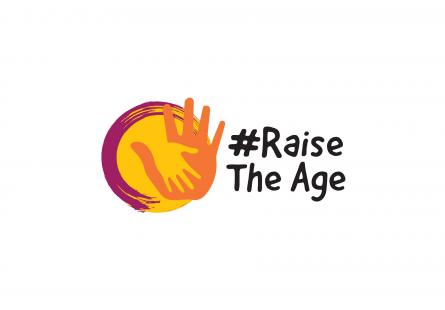 Logo for Raise the Age, depicting a yellow and an orange hand holding hand next to the words '# Raise the Age'