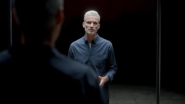 Campaign Ambassador Craig Foster reflected in mirror