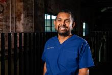 Headshot of Dinesh Palipana in medical scrubs